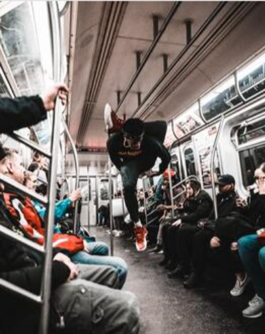Picture of acrobatic dancer on the subway in New York City