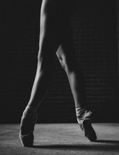 Picture of ballet dancer's legs while they stand on pointe